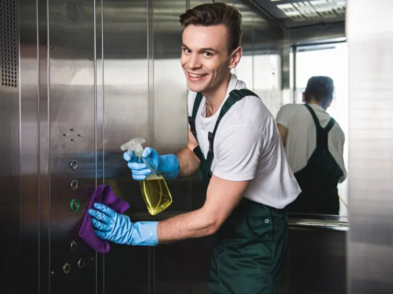 Cleaner making final checks and inspecting the cleaned spaces during a service