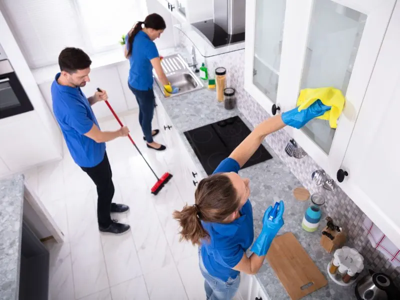 A kitchen being cleaned with Effective Cleaners after a renovation.