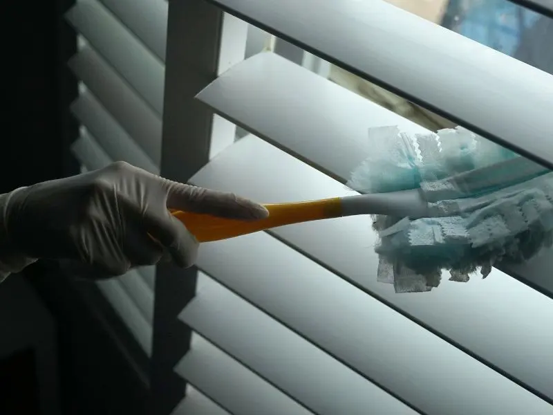 Dusting and polishing furniture as part of a deep cleaning service in Dublin