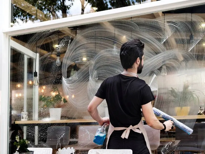 Wiping window frames to prepare for streak-free window cleaning